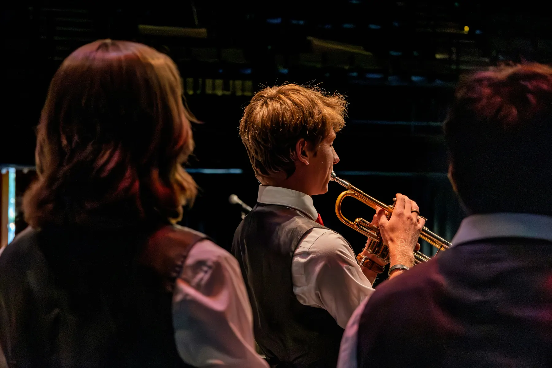 Students playing trumpet in a school band